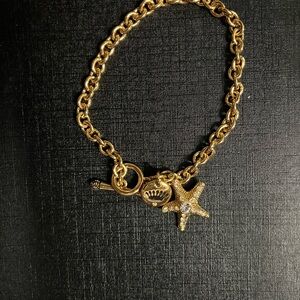 Juicy Couture Gold Charm Bracelet with Starfish and Crown